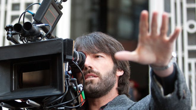 Affleck, who also directed " Argo, " takes in the scene on the set of the film.