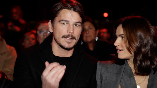 Actor Josh Hartnett, left, speaks with actress Kasia Smutniak prior to the Dsquared2 men's Fall-Winter 2018-19 collection, that was presented in Milan, Italy.