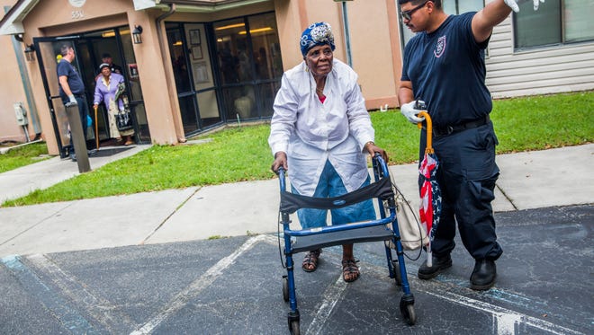 Milela Cineas is evacuated from Cypress Run, an affordable housing retirement home, in Immokalee as Hurricane Irma approaches on Saturday Sept. 9, 2017.