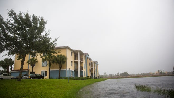 Water begins to pool in ditches and water levels rise in ponds near the Tuscan Isle Apartments on Sunday, September 10, 2017 as winds begin to pick up from Hurricane Irma.