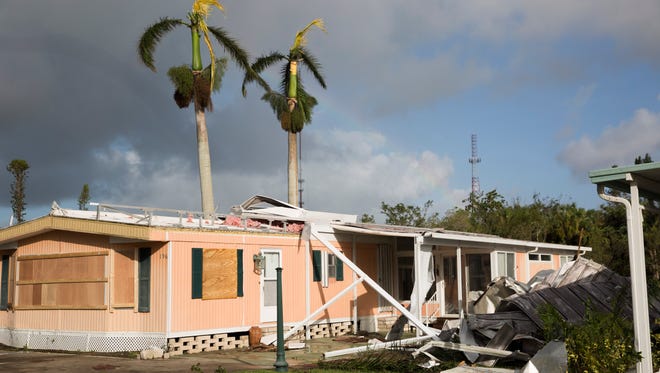 Damage can be seen a day after Hurricane Irma made its' way through Southwest Florida in Riverwood Estates, a 55-and-over mobile home community, Monday, September 11, 2017 in East Naples, Fla.