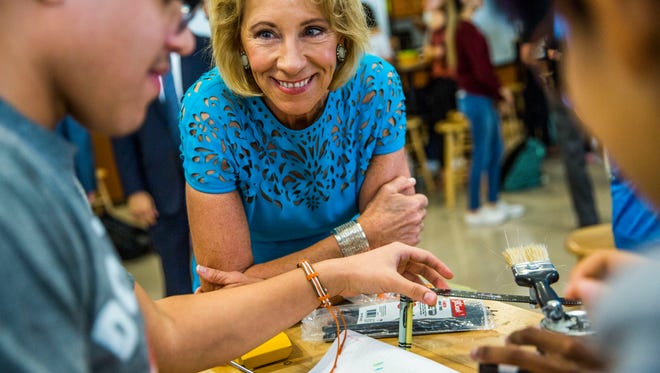 U.S. Education Secretary Betsy DeVos visits with a robotics class at FSW Collegiate High School on Monday, Nov. 27, 2017.