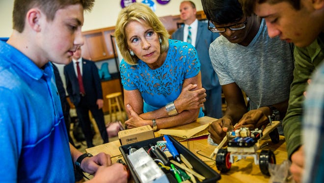U.S. Education Secretary Betsy DeVos visits with a robotics class at FSW Collegiate High School in Fort Myers on Monday, Nov. 27, 2017.