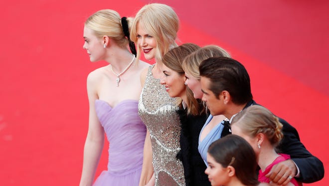 Elle Fanning, left, Nicole Kidman, director Sofia Coppola and other cast members arrive for the premiere of " The Beguiled " during the Cannes Film Festival.
