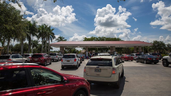 Cars line up to purchase gasoline in preparation for Hurricane Irma at the North Naples Costco gas station Tuesday, Sept. 5, 2017. On Monday, Florida Gov. Rick Scott issued a state of emergency for the state.