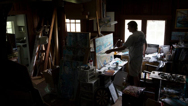 Artist Paul Arsenault paints a scene of Marco Island in his home studio Monday, Sept. 4, 2017, in downtown Naples. The United Arts Council surveyed more than 800 people to be part of the national assessment of The Arts and Prosperity. The results will be discussed at a public forum Wednesday at the Naples Daily News.
