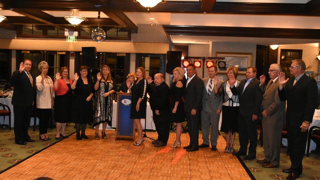 County Commissioner Donna Fiala, behind podium, swears in the new board. The Marco Island Area Chamber of Commerce held its installation of the 2018 slate of officers and directors, and graduation ceremony for the Leadership Marco class of 2017, Saturday evening at the Marco Island Yacht Club.