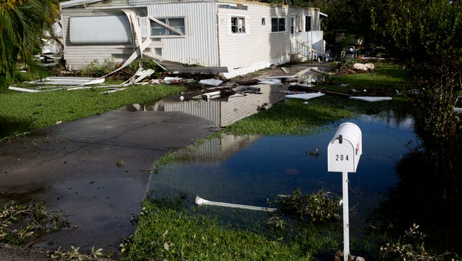 Damage can be seen a day after Hurricane Irma made its' way through Southwest Florida in Riverwood Estates, a 55-and-over mobile home community, Monday, September 11, 2017 in East Naples, Fla.