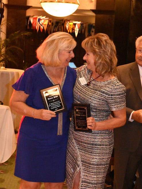 Dianna Dohm and Allyson Richards receive plaques for chairing the Leadership Marco class. The Marco Island Area Chamber of Commerce held its installation of the 2018 slate of officers and directors, and graduation ceremony for the Leadership Marco class of 2017, Saturday evening at the Marco Island Yacht Club.