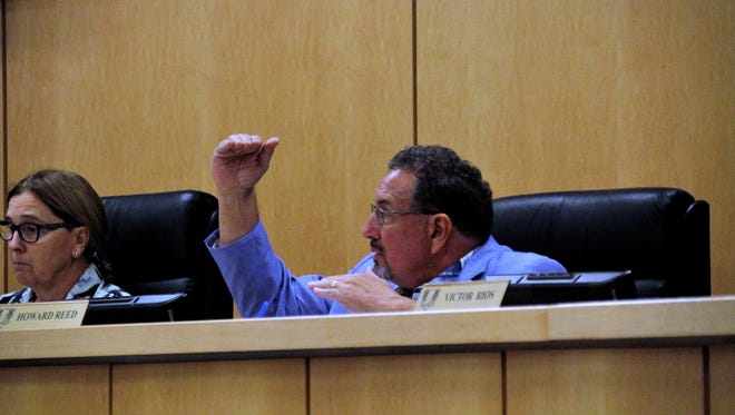 Councilor Howard Reed gestures to the members of Marco Island City Council where he believes the bar should be set for a new city manager.