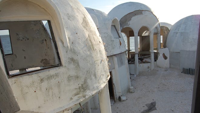 In this 2008 file photo, storms and vandalism ravage Cape Romano's dome homes. The owner, facing $250,000 or more in Collier County code fines, is hoping to get approval to reconstruct the homes.