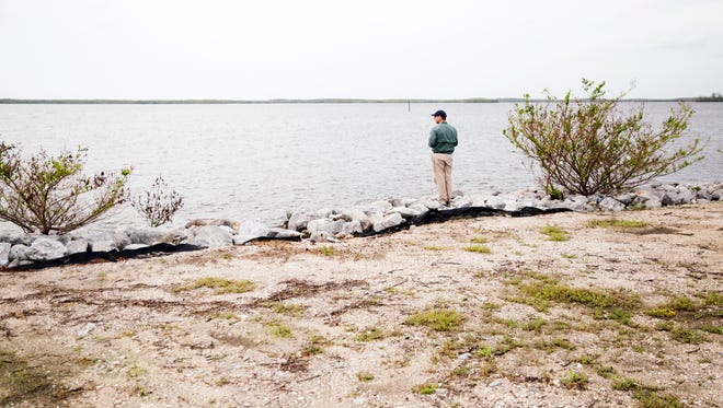 Marshall Critchfield, assistant secretary for fish and wildlife and parks, stands near the edge of Chokoloskee Bay at the Gulf Coast Visitor Center in Everglades National Park on Friday, October 6, 2017.