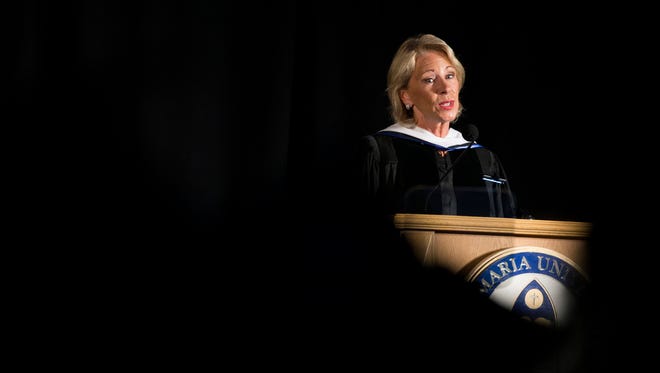 U.S. Secretary of Education Betsy DeVos delivers the commencement address during Ave Maria's 2018 graduation ceremony at Golisano Field House Saturday, May 5, 2018 in Ave Maria.