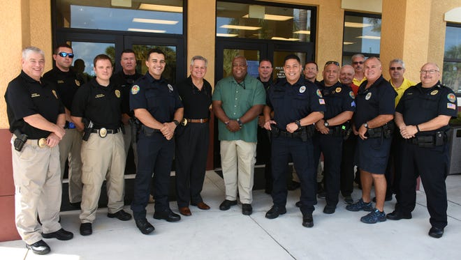 Marco Island police officers pose outside of the police department's building last year.