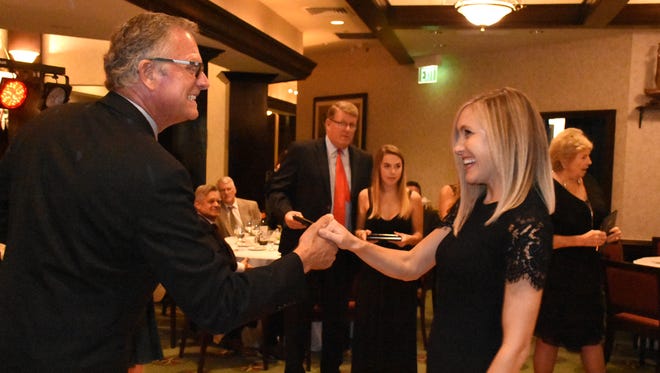 Outgoing president Alex Parker, left,  congratulates members of the Leadership Marco class. The Marco Island Area Chamber of Commerce held its installation of the 2018 slate of officers and directors, and graduation ceremony for the Leadership Marco class of 2017, Saturday evening at the Marco Island Yacht Club.