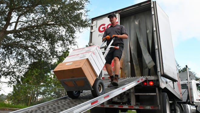 Bobby Goins of Gordon Food Servivce, delivers food for the shelter set up at Imperial Estates Elementary in Titusville on Friday, as residents prepare for Hurricane Irma.