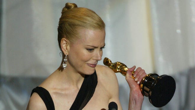 Nicole Kidman accepts the Oscar for best actress for her role in " The Hours " during the 75th Academy Awards.