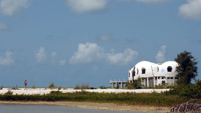 A popular stop for boaters in the Marco Island/Goodland area is Cape Romano, where a dome home still stands. Once a residence, the home is now falling into the sea, the result of storms and beach erosion that has changed and shifted the tip of the island southeast of Marco. Eric Strachan/Staff 2003