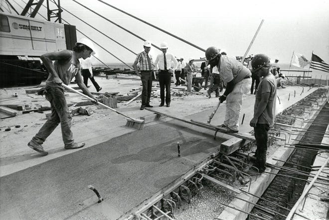 Sept. 26, 1988: Crews pour concrete to connect the two spans of the Dames Point Bridge, a significant milestone in the bridge ' s construction. [Bob Self, The Florida Times-Union]