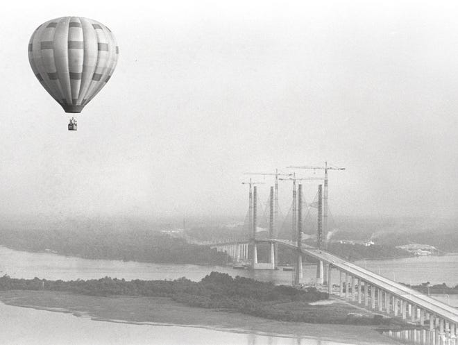 Sept. 24, 1988: Before the crowds came and before the hustle and bustle of the Dames Point bridge festivities began, a hot air balloon floats near the span. Construction cranes remain attached to the span. [Bruce M. Lipsky, The Florida Times-Union]