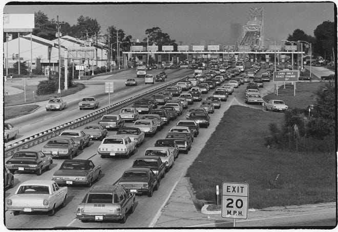 Mathews Bridge (August 1972): Backed up for a best-seller. Mathews Bridge morning traffic backed up in August 1973 when ticket books went on sale to take the sting out of an impending toll increase. Toll-book buyers could cross for 15 cents; others paid a quarter. Bridge tolls were part of Jacksonville ' s daily life until they were removed Aug. 11, 1989.