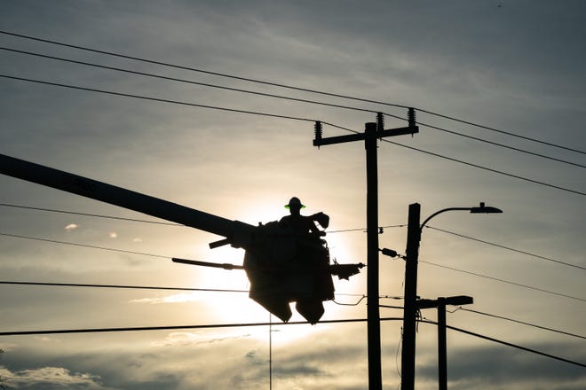A lineman works to restore service after Hurricane Idalia crossed the state on August 30, 2023 in Perry, Fla.
