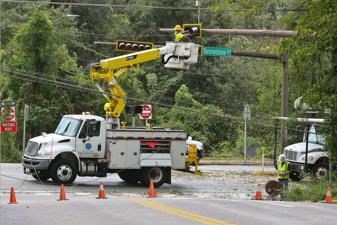 A City of Tallahassee electrical crew works to repair a street light in the aftermath of Hurricane Idalia in Tallahassee, Fla., Wednesday, Aug. 30, 2023.