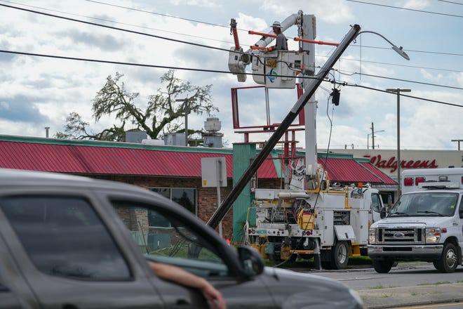 Workers repair power lines in Perry, Fl. on Aug 30, 2023. The Gulf Coast of Florida was hit by Hurricane Idalia Wednesday. The storm landed as a Category 3 along FloridaÕs Big Bend area, leaving some homes and businesses destroyed.