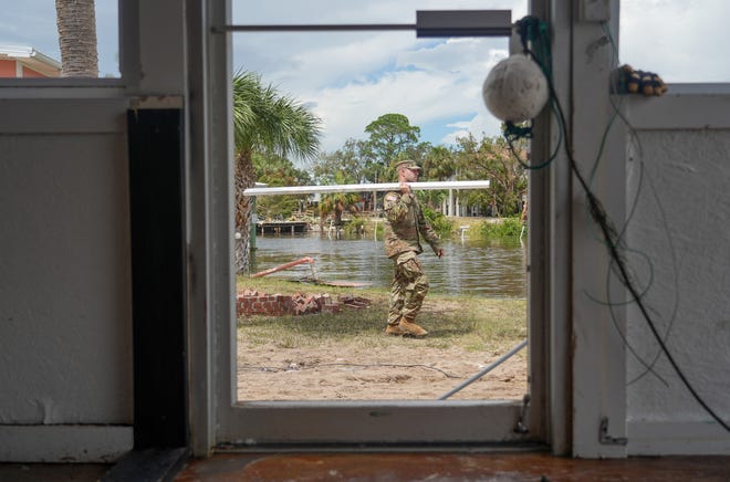 Members of the National Guard help clean out a restaurant and shop in Horseshoe Beach, Fl. on Aug 31, 2023. Hurricane Idalia made landfall on the Gulf Coast of Florida. The Category 3 storm made landfall Wednesday leaving some homes and businesses destroyed.