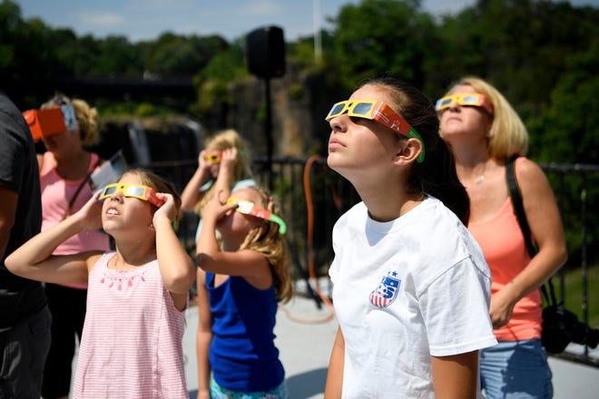 The Paterson Great Falls National Park hosted a solar eclipse viewing party, supplying attendees with eclipse glasses and books for children on Monday, August 21, 2017.