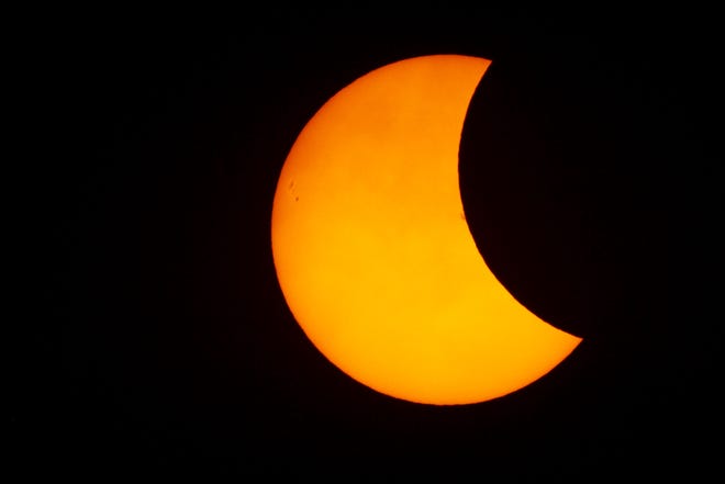 In this photo, the 2017 Great American Solar Eclipse was just starting in Fort Myers, Florida. This image was taken from Fort Myers Beach.