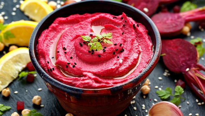 Roasted beet hummus (directions) • Total time: 15 minutes (plus additional time if you are roasting the beet) Peel the roasted beet and blend it in a food processor with the garlic. Add the chickpeas, tahini, lemon zest, and lemon juice and blend until smooth. Drizzle in the olive oil while blending. Add salt and pepper to taste. If the hummus is too thick for your liking, blend in a little water to thin it out.