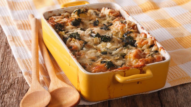 Spinach and cheese strata (directions) • Total time: 1 hour 15 minutes, 8 hours hold time In a large, heavy skillet, saut é the onion in butter over medium heat until soft, about 5 minutes. Add 1/2 teaspoon salt, 1/4 teaspoon pepper, and nutmeg and continue cooking for one minute. Stir in spinach, remove from heat, and set aside. Spread one-third of the bread cubes in a well-buttered 3-quart ceramic baking dish. Top with one-third of spinach mixture and one-third of each cheese. Repeat layering twice with remaining bread, spinach, and cheese. Whisk the eggs, milk, mustard, and remaining 1/2 teaspoon salt and 1/4 teaspoon pepper together in a large bowl and pour evenly over strata. Cover with plastic wrap and chill strata for at least 8 hours or up to a day. When ready to cook, let the strata stand at room temperature for 30 minutes while preheating the oven to 350 ° F. Bake, uncovered, in the middle of the oven until puffed, golden brown, and set in the center, 45 to 55 minutes. Let stand 5 minutes before serving.