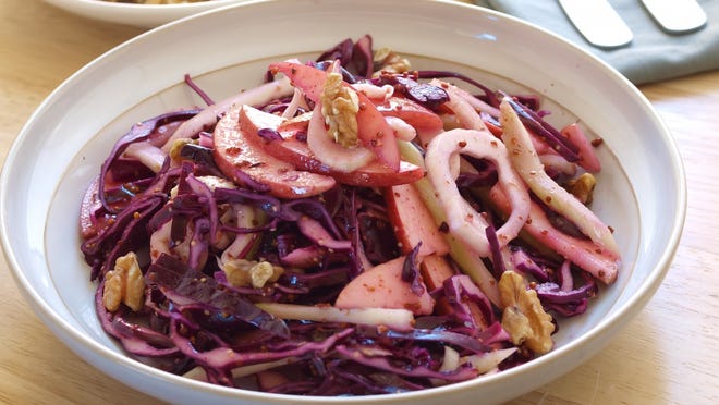 Fennel, apple, and purple cabbage slaw (directions) • Total time: 20 minutes Using a vegetable peeler, shave the fennel bulb into thin strips. Combine the shaved fennel, cabbage, scallions, and apple together in a medium bowl. Whisk the mayonnaise, lemon juice and zest, fennel fronds, sugar, and salt and pepper, to taste, in a small bowl. Add the dressing to the slaw and toss to coat.