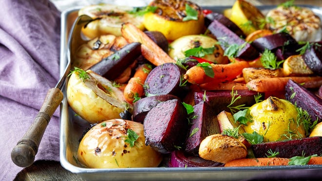 Herbed roasted root vegetables (directions) • Total time: 1 hour Preheat oven to 400 ° F and place a rack in the bottom position. Slice all vegetables into chunks roughly 1 1/2 inches wide, leaving the garlic cloves whole. Place the vegetables into a large mixing bowl. Add 3 tablespoons of the olive oil, fresh thyme leaves, ground cumin, kosher salt, and black pepper. Stir until all vegetables are evenly coated with oil, spices, and herbs. Brush a large, rimmed baking sheet with the remaining 1 tablespoon olive oil. Spread the vegetables out evenly on the baking sheet. Place the rosemary sprigs on top of the vegetables. Roast the vegetables in the oven for 15 minutes. Stir them, bringing the chunks from the outside towards the center and the chunks in the center out towards the edges. Return to the oven and continue to roast until the largest chunks are tender and the edges are starting to turn golden/dark, another 15-25 minutes. Remove the roasted rosemary sprigs and stir the vegetables (some leaves of rosemary will remain, this is good). Season with additional salt and pepper to taste. The roots can be served warm or at room temperature.