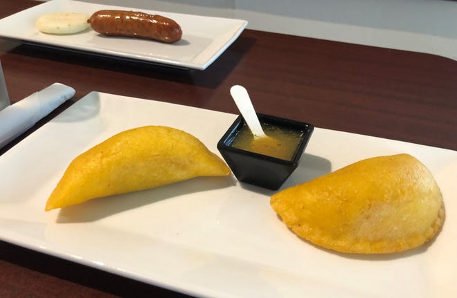 Foreground, empanadas; background, chorizo and small arepa from The Colombian Kitchen, Bonita Springs.