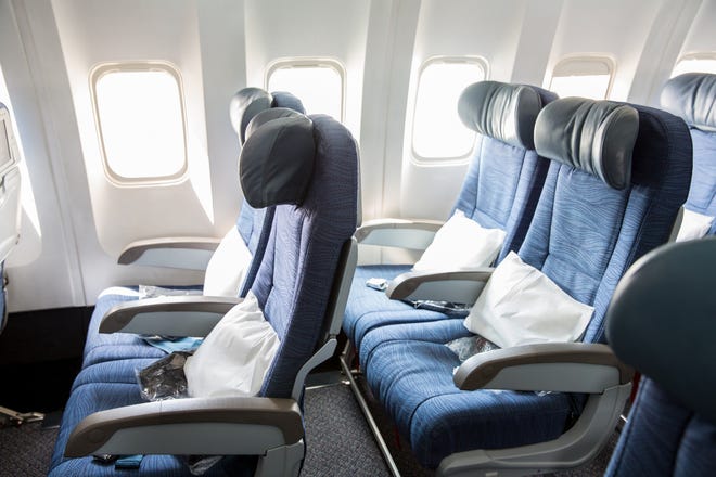Americans are getting larger and airline seats are shrinking.