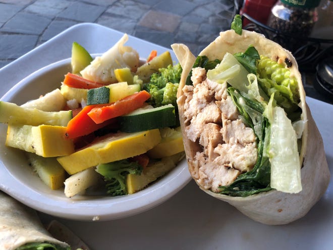 The chicken Caesar wrap and mixed veggies from Sunset Grille, Marco Island.