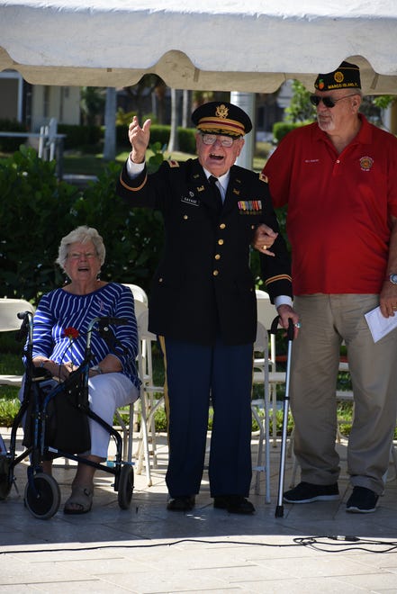 Retired colonel and WWII vet Herb Savage is serenaded with "Happy Birthday," although he doesn't turn 100 till January. Marco Island honored veterans, in particular female veterans, in Veterans Community Park for Veterans Day, at 11 a.m. Monday, Nov. 12.