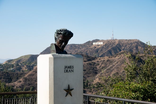 The film " Rebel Without a Cause " was partially filmed at Griffith Observatory. A bust to honor the late actor James Dean is at the observatory, with the iconic Hollywood sign in the background.