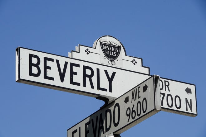 Next stop: Beverly Hills. The corner of North Beverly Drive and Elevado Avenue in Beverly Hills is just down the street from the fabled Beverly Hills Hotel, and is a popular tourist spot for seeing giant mansions and oversize palm trees.