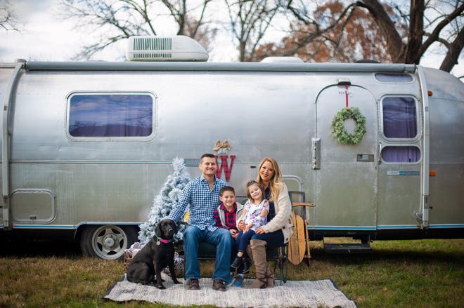 Family photo of Jesse and Caroline Wasson along with their kids Bennett and Harlynn in Springfield, Missouri. The family has a 1970 Airstream Overlander.