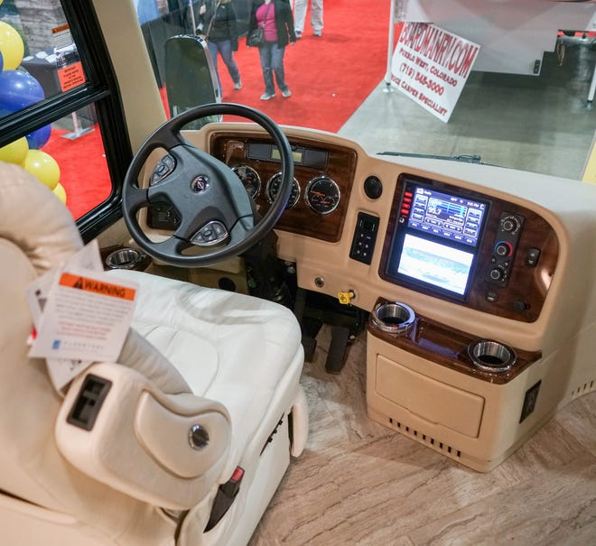 The driver's seat/command center of a luxury RV based on a bus chassis.