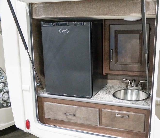 Outdoor sinks and refrigerators are now common on many larger RV trailers.