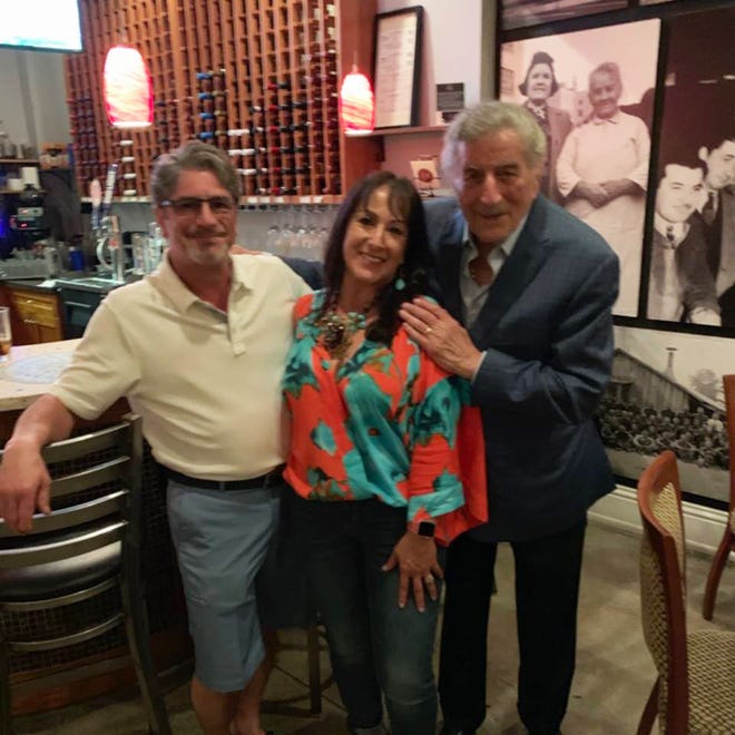 Grammy award-winner Tony Bennett stands with owners Peter and Maria DellaRocca at Parmesan Pete's on Sunday, March 24, 2019. Bennett dined at the family-owned restaurant the night before performing at Artis—Naples.
