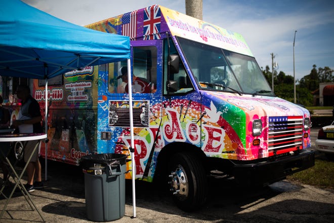 Dave's Cosmic Subs food truck serves customers at the Naples City Live event in Naples on April 6, 2019. The event featured a dozen local food trucks, a market that has grown exponentially in recent years.