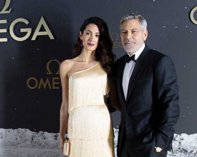 George and Amal Clooney at the red carpet outside the Apollo/Saturn V Center Thursday evening. The Swiss watch brand Omega, which accompanied Apollo 11 astronaut Buzz Aldrin when he walked on the moon's surface nearly 50 years ago, hosted an event honoring the 50th anniversary of the moon landing at the Apollo/Saturn V Center at the Kennedy Space Center. Those who attended the black-tie dinner included actor George Clooney,  as well as former astronauts Thomas Stafford and Charles Moss Duke.