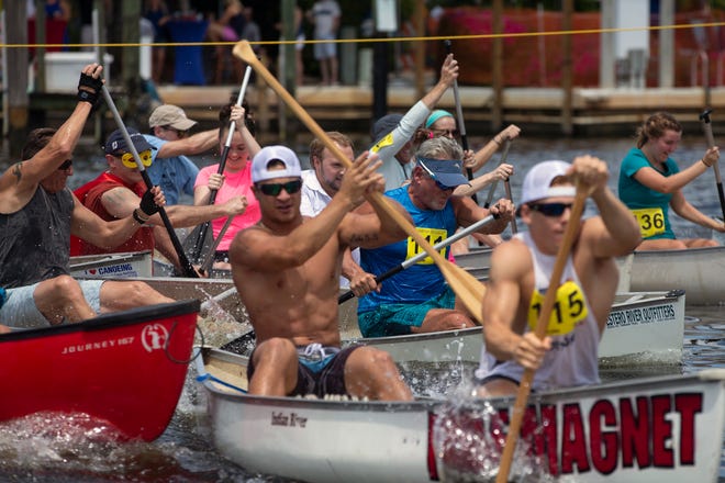 Participants in the Ambitious Amateur canoe race compete Saturday, May 11, 2019, during the 43rd annual Great Dock Canoe Race at Crayton Cove in Naples.