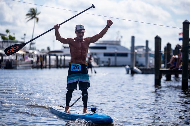 Mark Athanacio from Bonita Springs wins the professional paddleboard race Saturday, May 11, 2019, during the 43rd annual Great Dock Canoe Race at Crayton Cove in Naples.