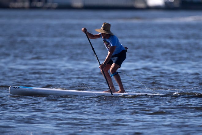 Simon Tracy of Naples participates in the amateur stand up paddleboard race, Saturday, May 11, 2019, during the 43rd annual Great Dock Canoe Race at Crayton Cove in Naples.